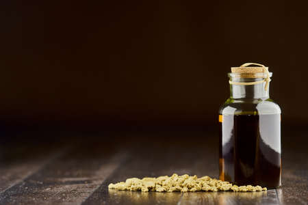 Soybean oil and oilcake on a wooden floor