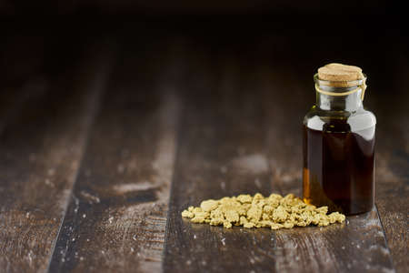 Soybean oil and oilcake on a wooden floor close upの写真素材
