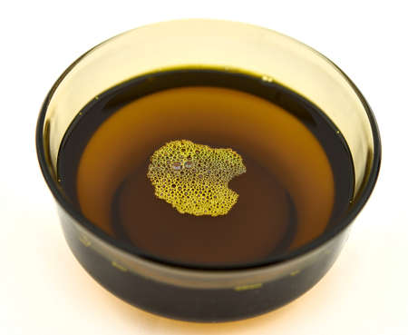 Soybean oil in a bowl on a white backgroundの写真素材