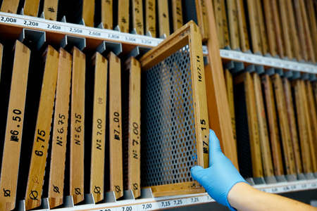 shelves with screens for sifting grains of different sizesの写真素材
