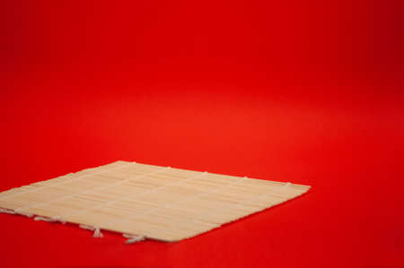 Bamboo sheet on a red background.