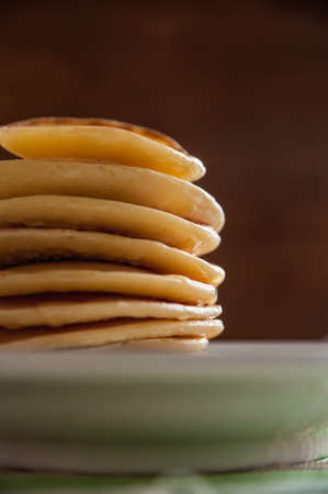 fragrant pancakes for breakfast with a spoonful of honey flavoredの写真素材