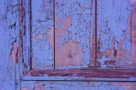 purple wood texture with peeling paintの写真素材