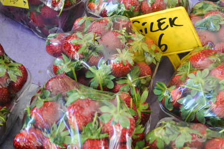 packaged a strawberries under plastic sheets soldの写真素材