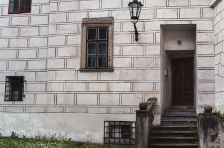 Door, window and a lantern in an ancient castleの写真素材