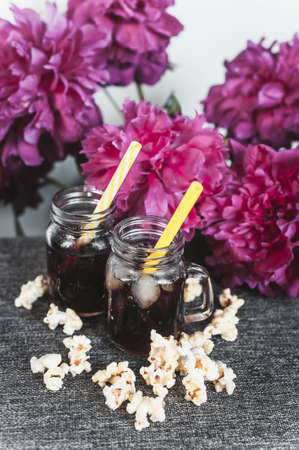misted bottles of Cola with ice and fresh kettle corn