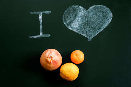 I love citrus - inscription chalk on the Board. Grapefruit, orange and tangerineの写真素材