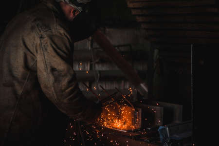 The job of a welder. A large concrete products plant and welding on it.の写真素材