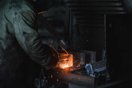 The job of a welder. A large concrete products plant and welding on it.の写真素材