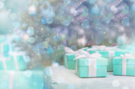 Boxes Tiffany colour on the background Christmas tree. Christmas backgroundの写真素材