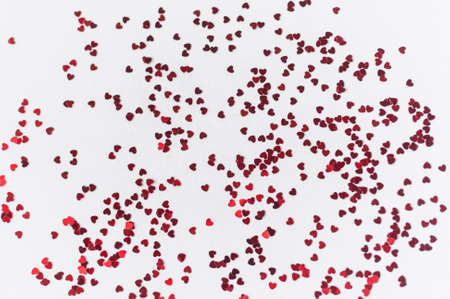a scattering of red hearts on a white background. Texture for Valentines dayの写真素材