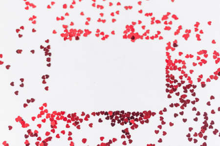 a scattering of red hearts on a white background. Texture for Valentines dayの写真素材