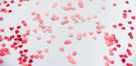a scattering of red hearts on a white background. Texture for Valentines dayの写真素材