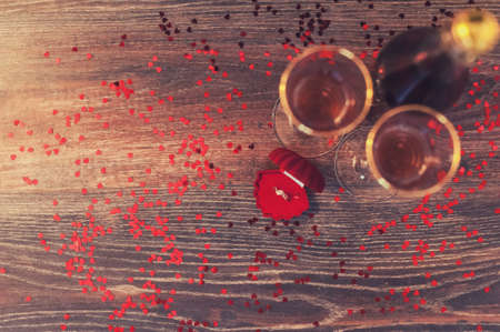 A red box with a ring, marriage proposal, Valentines Day, wine, romantic atmosphereの写真素材