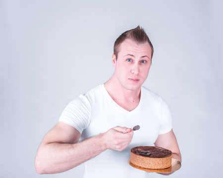 Young athlete with the cake. Healthy diet food. The concept of proper nutrition and healthy sweets.の写真素材