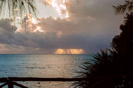 Dawn over the Indian ocean. Sun and sky in the tropics. The Island Of Zanzibar, Tanzaniaの写真素材