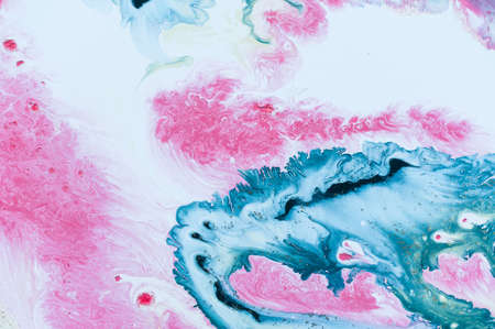 Abstract colorful background. Drawing with acrylic paints on water. Texture play of paint.の写真素材