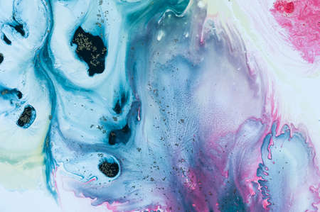 Abstract colorful background. Drawing with acrylic paints on water. Texture play of paint.の写真素材