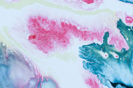 Abstract colorful background. Drawing with acrylic paints on water. Texture play of paint.