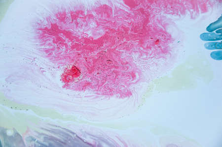 Abstract colorful background. Drawing with acrylic paints on water. Texture play of paint.の写真素材