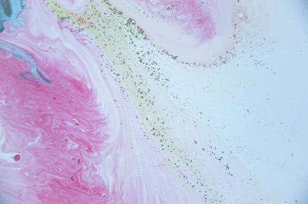Abstract colorful background. Drawing with acrylic paints on water. Texture play of paint.の写真素材