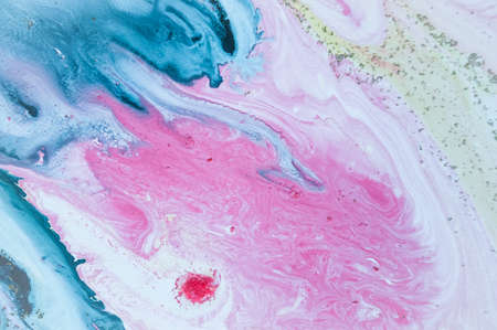 Abstract colorful background. Drawing with acrylic paints on water. Texture play of paint.の写真素材