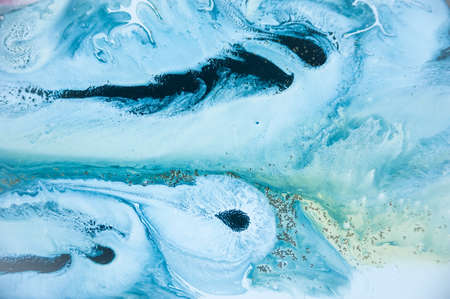 Abstract colorful background. Drawing with acrylic paints on water. Texture play of paint.の写真素材