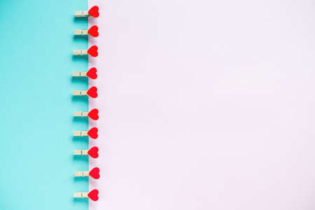 Hearts on pastel blue and pink background. Valentines day concept. Flat lay, top view, copy space. Valentine's Day background. の写真素材
