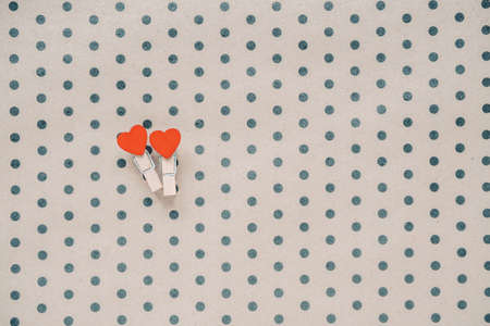 Two hearts on a crafting polka dot background. Holidays concept. Flat lay, top view, copy space. Valentine's Day background. の写真素材
