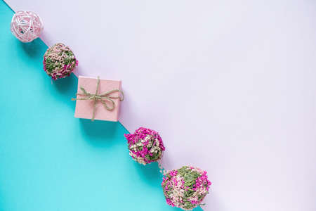 Gifts and decor on pastel blue and pink background. Holidays concept. Flat lay, top view, copy space. Valentines Day background.の写真素材
