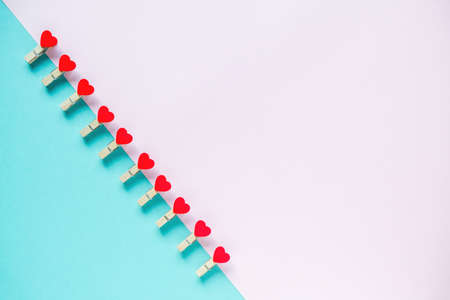 Hearts on pastel blue and pink background. Valentines day concept. Flat lay, top view, copy space. Valentine's Day background. の写真素材