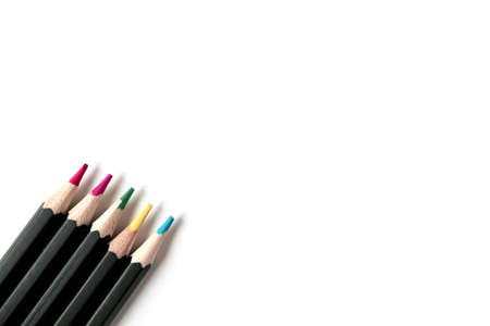 Colored wooden pencils on white isolated background. Top view, Flatlayの写真素材