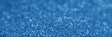 Banner of blurred blue sequins. The main color trendの写真素材