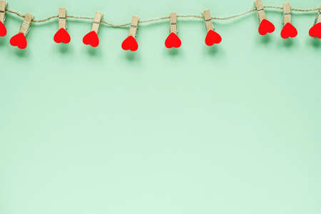 Hearts on pastel mint background. Valentines day concept. Flat lay, top view, copy space. Valentine's Day background. の写真素材