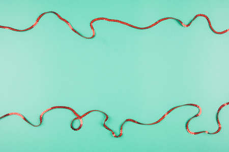 Delicate mint background with red ribbons. Space for text. St. Patrick's Day. Background for Christmasの写真素材