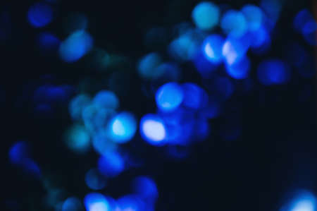 Blue lights and sparkles in defocus. Abstract stylish background. Photo overlay and design toolの写真素材