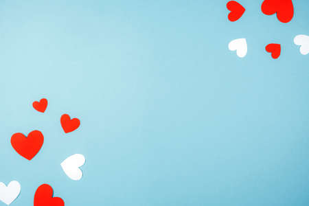 Delicate blue background with red hearts. Place for text, Valentines day, postcardの写真素材