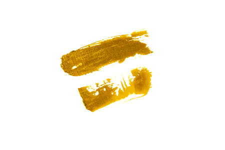 Double DAB of the cream is Golden in color. Swatch of lipstick or eye shadow. The concept of makeupの写真素材