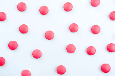 Medical background with tablets. Space for text. Banner with white red pillsの写真素材