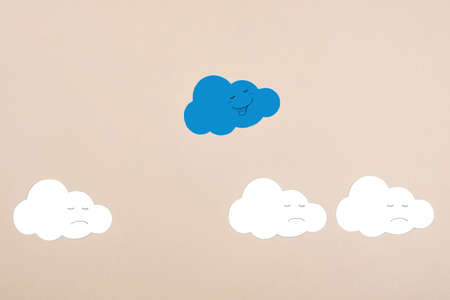 Cut out clouds on a neutral background. The concept of positive thinking, being different. Getting out of your comfort zoneの写真素材