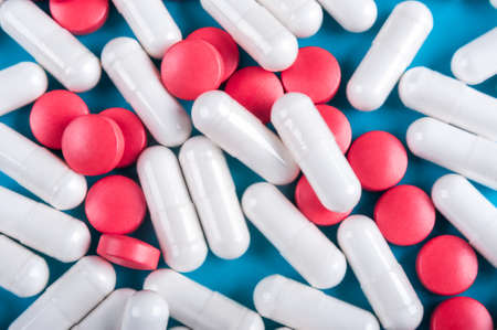 Blue  with red and white tablets.の写真素材
