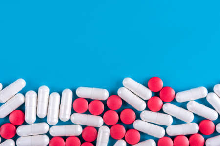 Blue  with red and white tablets.の写真素材