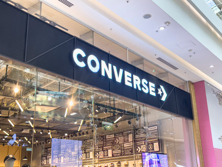 September 21, 2025, Astana, Republic of Kazakhstan: Converse store entrance in a shopping mall with illuminated sign and glass facade, modern retail environment.のeditorial素材