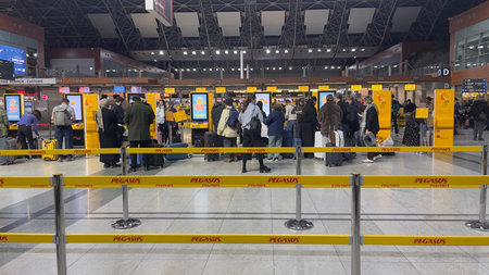 Istanbul, Turkey â€“ February 19, 2026: Passengers queue at Pegasus check in area inside Sabiha...
