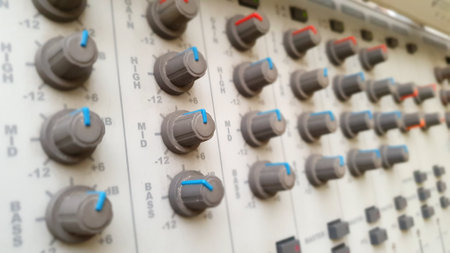 Audio studio sound mixer equalizer board sliders, faders and knobs, top view