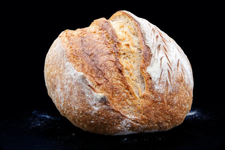Black rye bread with a crispy crust and a spongy texture. Freshly baked homemade bread. Vermont. Diet. On sourdough. Photo in high quality.の写真素材
