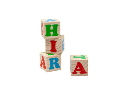 Wooden childrens cubes with letters of different colors for play.