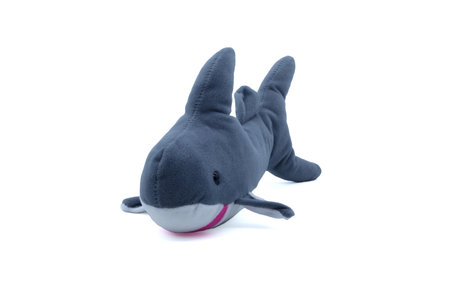 Cute gray plush shark toy with a soft texture, photographed on a white background. Ideal for children's toys, marine-themed designs, or baby room decoration.の写真素材