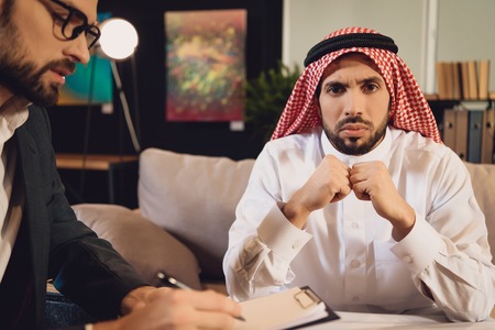 Arabic man at psychotherapist reception in depression. Concept of psychotherapist. Visit to...