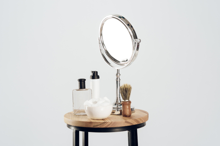 Composition of mirror and shaving set. Still life. Men shaving concept. Isolated on white background.